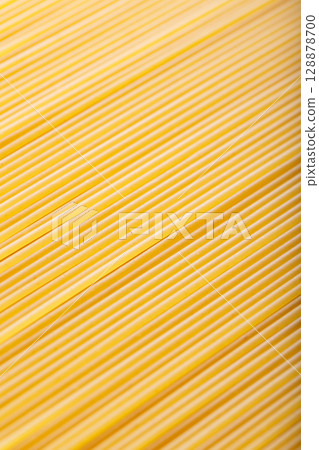 Raw Spaghetti Noodles in Diagonal Food Background Macro Shot 128878700