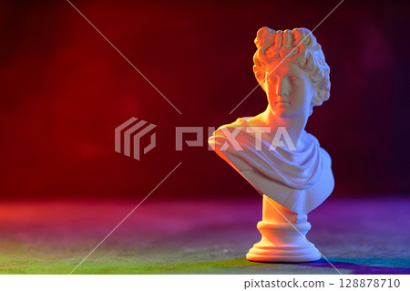 Classical Sculpture Bust Illuminated with Tricolor Neon Lights 128878710
