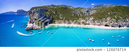 Best and most beautiful beaches of Sardegna island (Italy) - Cala Luna in gulf of Orosei a spectacular national park, Aerial panoramic drone view 128878714