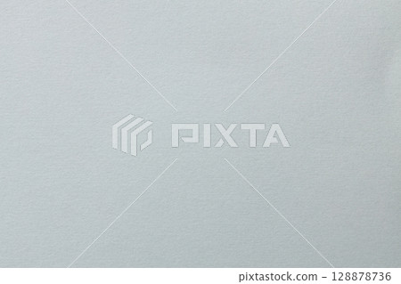 Minimal Gray Surface with Soft Grainy Paper Texture Close-Up Minimal Gray Surface with Soft Grainy Paper Texture Close-Up 128878736