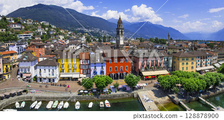 Switzerland travel and landmarks - colorful charming town Ascona, lake Lago Maggiore near Locarno , canton Ticino . aerial drone panoramic view of old town 128878900