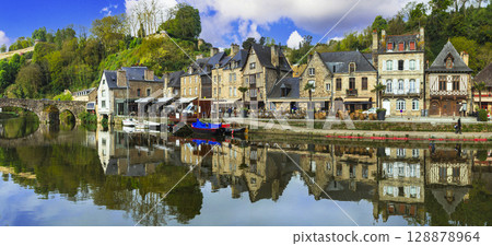 France travel, most scenic villages and towns of Brittany. Picturesque traditional port of Dinan with half-timbered houses, restaurants over canals France travel, most scenic villages and towns of Brittany. Picturesque traditional port of Dinan with half-timbered houses, restaurants over canals 128878964