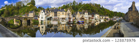 France travel, most scenic villages and  romantic towns of Brittany. Picturesque traditional port of Dinan with half-timbered houses, restaurants over canals 128878976