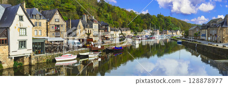 France travel, most scenic villages and towns of Brittany. Picturesque traditional port of Dinan with half-timbered houses, restaurants over canals 128878977