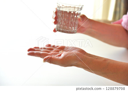 Seniors taking oral medication 128879708