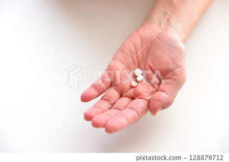 Seniors taking oral medication Seniors taking oral medication 128879712