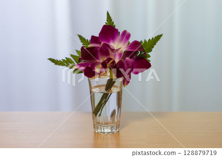 Fresh flower corsage in a glass 128879719