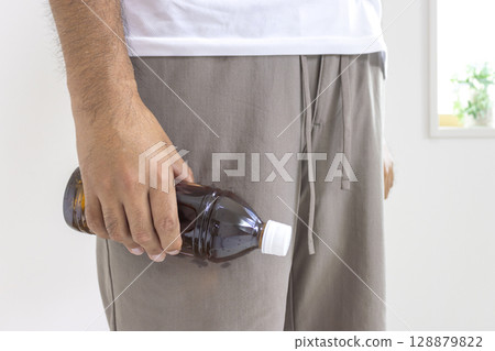 Sweaty man's arm holding a plastic bottle (Japanese, 30s, no face) Sweaty man's arm holding a plastic bottle (Japanese, 30s, no face) 128879822