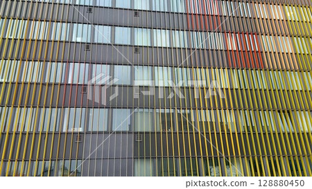 A Colorful and Contemporary Building Facade Featuring an EyeCatching Striped Design A Colorful and Contemporary Building Facade Featuring an EyeCatching Striped Design 128880450