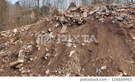 Construction Debris and Earth Pile Accumulated at Demolition Site Needing Attention Construction Debris and Earth Pile Accumulated at Demolition Site Needing Attention 128880463