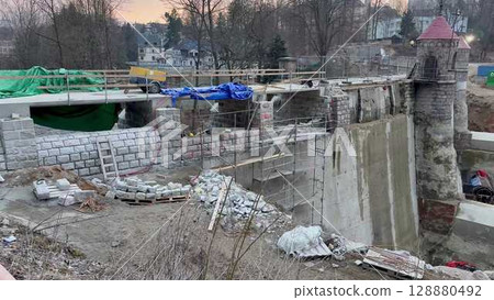 The ongoing construction progress on a project site during the beautiful time of dusk 128880492