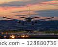 Arrival flight at dusk, plane landing 128880736
