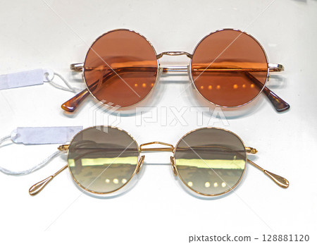 Circle sunglasses on street market 128881120