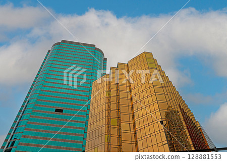 Gold blue glass facade buildings Gold blue glass facade buildings 128881553