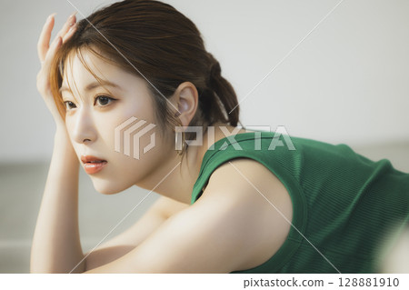 A woman lying on the floor A woman lying on the floor 128881910