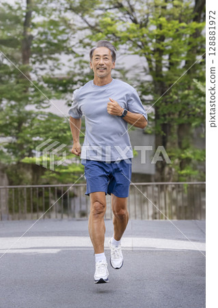 A man in his 60s running 128881972
