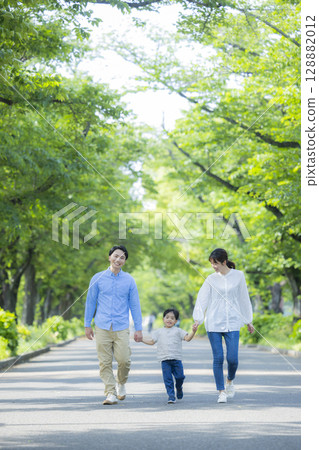 Family walking in the fresh green park Family walking in the fresh green park 128882012