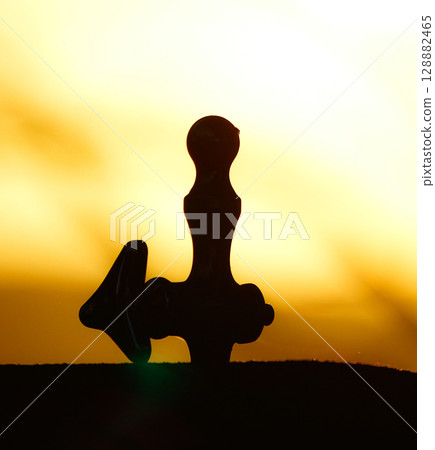 Silhouette of a drinking fountain in a park at dusk Silhouette of a drinking fountain in a park at dusk 128882465