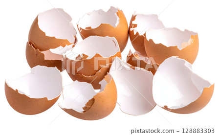 Group of Empty Brown Eggshells Stacked Together 128883303