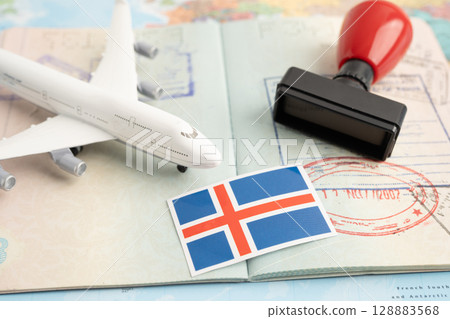 Iceland flag and passport with airplane for travel. Iceland flag and passport with airplane for travel. 128883568