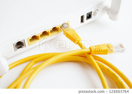 Ethernet cable with wireless router connect to internet service provider network. 128883764