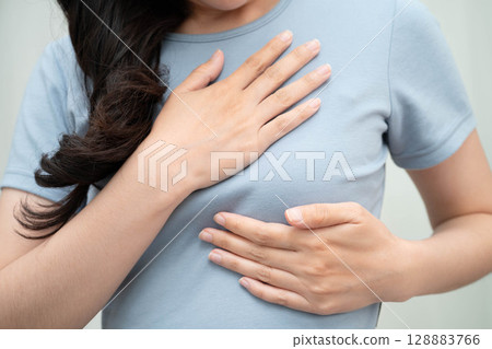 Asian woman self touching check lump or Breast cancer, Breast Self Exam. Asian woman self touching check lump or Breast cancer, Breast Self Exam. 128883766
