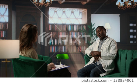 Medic in uniform sharing his feelings and medical career struggles, suffering from anxiety and mental health issues. Psychiatrist listens with empathy, discuss emotional support. Camera A. 128884001