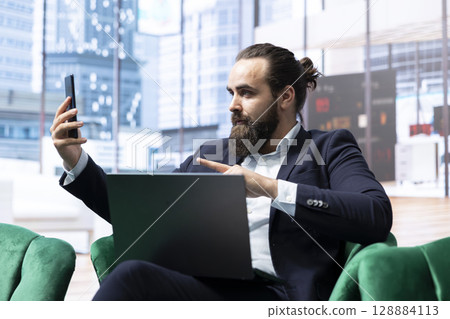 Ambitious determined leader negotiating with associates on web video call, trying to expand the enterprise globally. Young chief executive officer needs funding for career success. 128884113