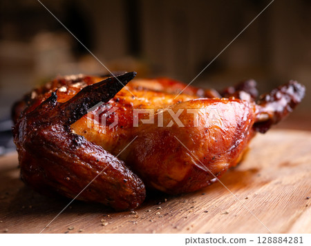 Crispy Roasted Whole Chicken Close-Up. Crispy Roasted Whole Chicken Close-Up. 128884281