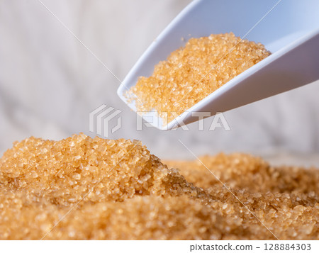 Organic Light Brown Sugar with versatile scoop. Organic Light Brown Sugar with versatile scoop. 128884303