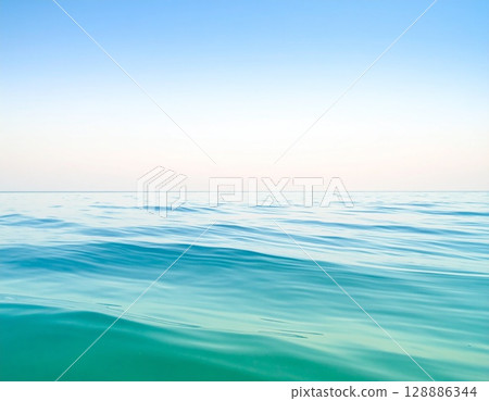 A landscape of the blue sea and gentle waves swaying quietly 128886344
