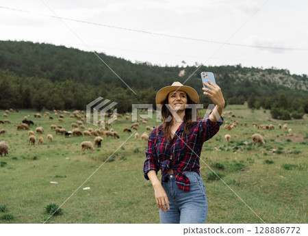 A woman in a plaid shirt 128886772