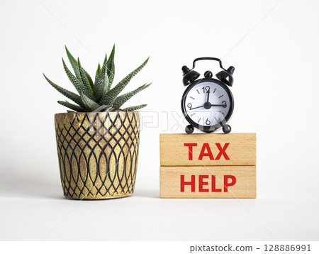 Tax Help symbol. Concept word Tax Help on Beautiful white background with alarm clock and succulent plant. Business and Tax Help concept. Copy space 128886991