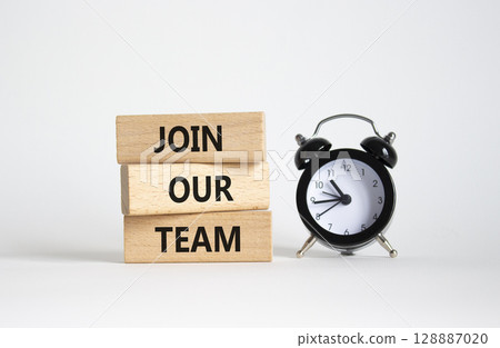 Join our team symbol. Wooden blocks with words Join our team. Beautiful white background with alarm clock. Business and Join our team concept. Copy space. 128887020