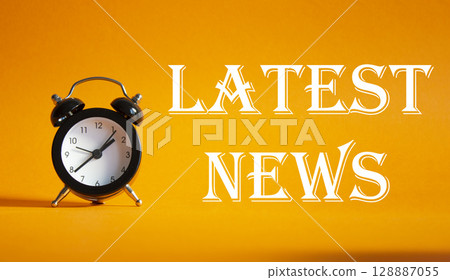 Latest News symbol. Concept word Latest News on Beautiful orange background with alarm clock. Business and Latest News concept. Copy space 128887055
