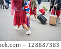 Tourist group arriving at railway station 128887383