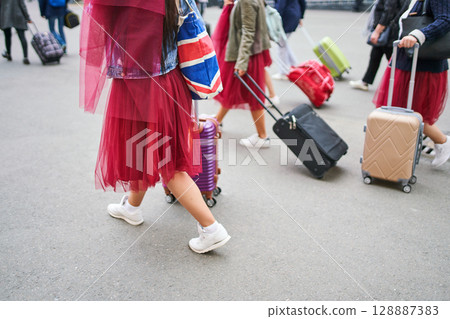 Tourist group arriving at railway station 128887383