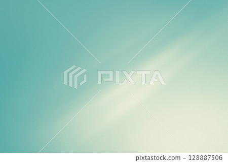 柔和的燈光照射在柔和的綠松石背景上 128887506