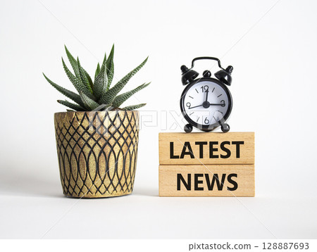Latest News symbol. Concept words Latest News on wooden blocks. Beautiful white background with alarm clock and succulent plant. Business and Latest News concept. Copy space. Latest News symbol. Concept words Latest News on wooden blocks. Beautiful white background with alarm clock and succulent plant. Business and Latest News concept. Copy space. 128887693
