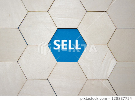 Sell symbol. Concept word Sell on wooden comb puzzle. Beautiful blue background. Business and Sell concept. Copy space. 128887734