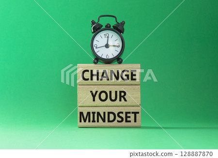 Change your mindset symbol. Concept words Change your mindset on wooden blocks with alarm clock. Beautiful green background. Business and Change your mindset concept. Copy space. 128887870