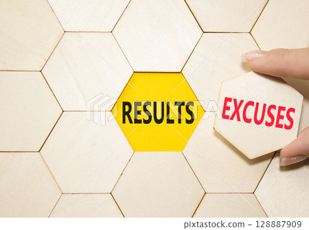 Results or Excuses symbol. Concept word Results or Excuses on wooden comb puzzle. Businessman hand. Beautiful yellow background. Business and Results or Excuses concept. Copy space 128887909
