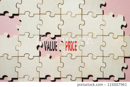 Price and Value symbol. Concept word Price and Value on wooden puzzle. Beautiful pink background. Business and Price and Value concept. Copy space 128887961