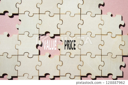 Price and Value symbol. Concept word Price and Value on wooden puzzle. Beautiful pink background. Business and Price and Value concept. Copy space 128887962