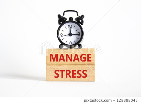 Manage stress symbol. Concept word Manage stress on wooden blocks. Beautiful white background with alarm clock. Business and Manage stress concept. Copy space Manage stress symbol. Concept word Manage stress on wooden blocks. Beautiful white background with alarm clock. Business and Manage stress concept. Copy space 128888043