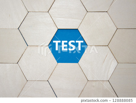 Test symbol. Concept word Test on wooden comb puzzle. Beautiful blue background. Business and Test concept. Copy space. 128888085
