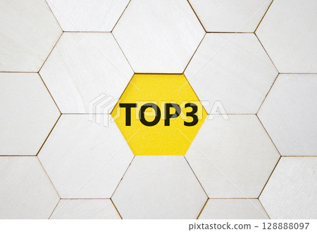 Top 3 symbol. Concept word Top 3 on wooden comb puzzle. Beautiful yellow background. Business and Top 3 concept. Copy space. 128888097