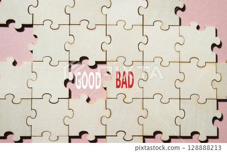 Good or Bad symbol. Concept word Good or Bad on wooden puzzle. Beautiful pink background. Business and Good or Bad concept. Copy space Good or Bad symbol. Concept word Good or Bad on wooden puzzle. Beautiful pink background. Business and Good or Bad concept. Copy space 128888213