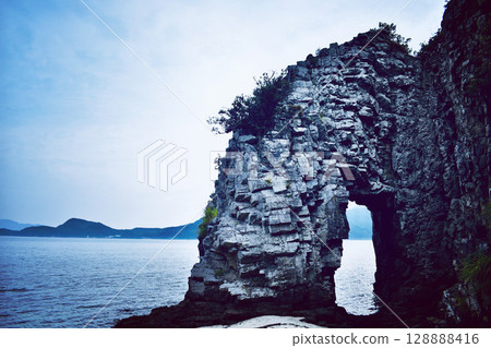 Strangely shaped rock formations on the coast 128888416