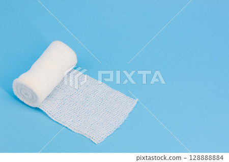 Bandages on a light blue background Bandages on a light blue background 128888884